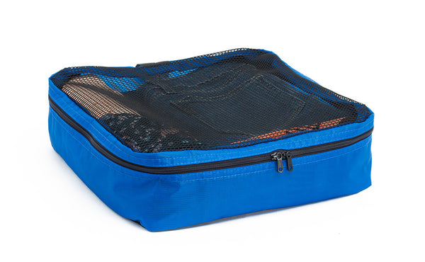 A filled and zipped closed Island (blue) Aether Large Aeronaut 30 Packing Cube.